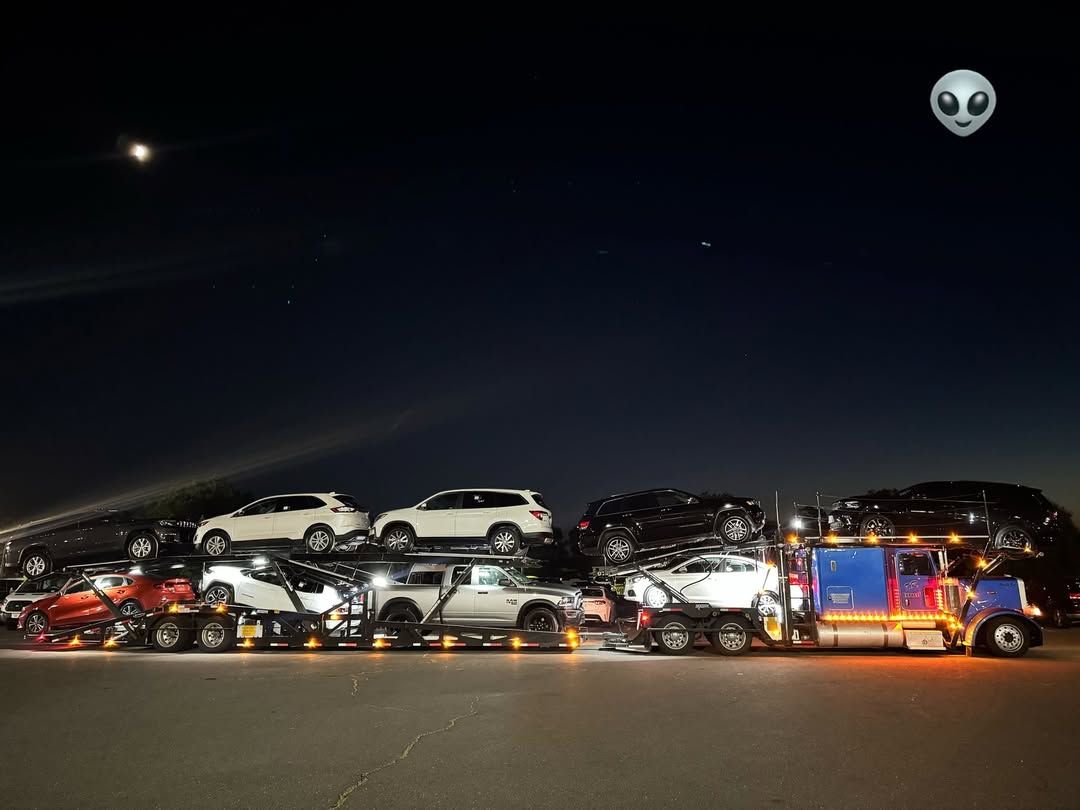 Fully loaded car carrier at night