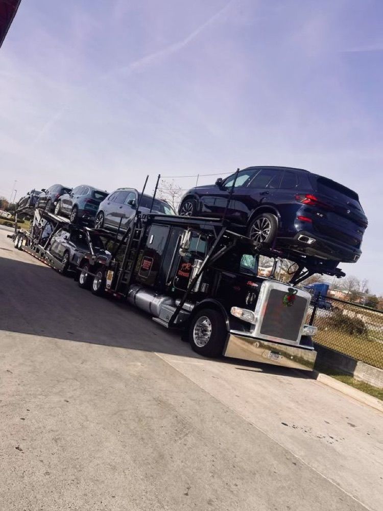 Carrier loaded with BMW SUVs