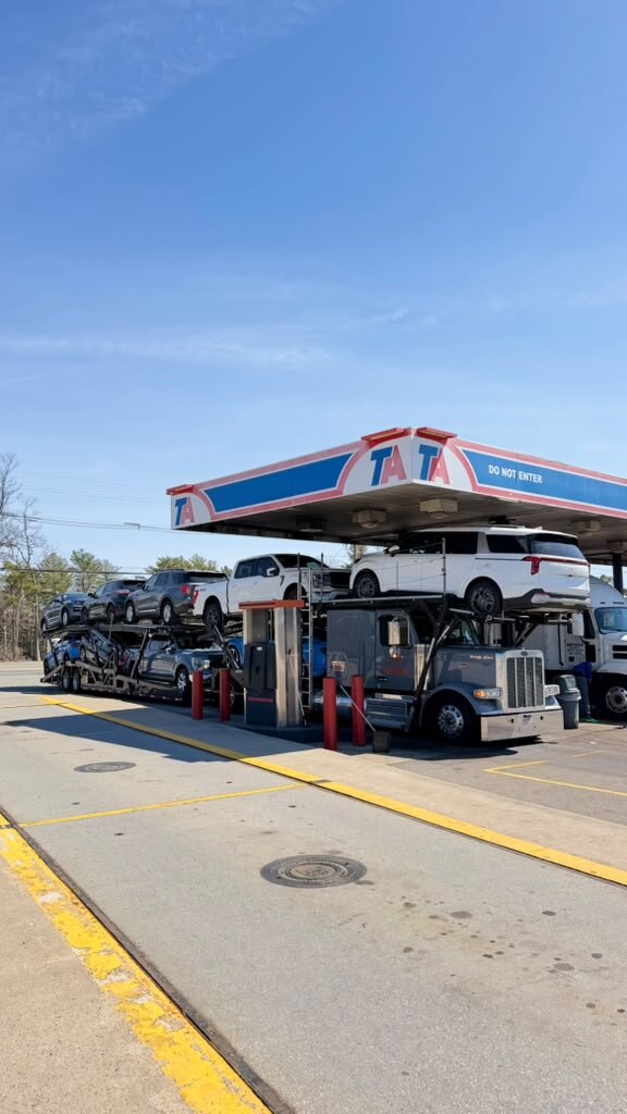 Loaded car carrier refueling at a TA truck stop